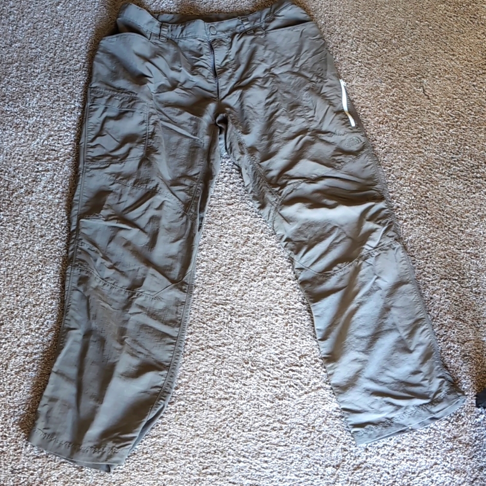 A pair of north-face pants are 100% nylon brown, size 36, like brand new